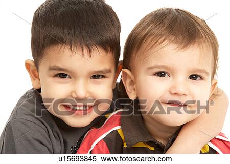 Studio Portrait Of Young Brothers View Large Photo Image Stock Photography - Studio Portrait Of Young Brothers. Fotosearch