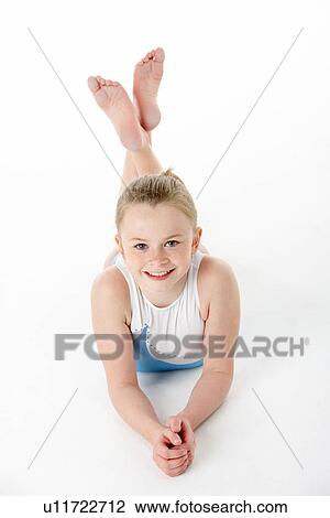 Stock Image - Studio Portrait Of Young Female Gymnast. Fotosearch