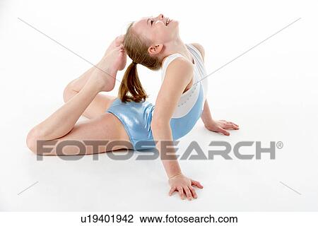 Stock Image - Studio Portrait Of Young Female Gymnast. Fotosearch