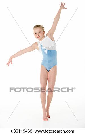 Stock Image - Studio Portrait Of Young Female Gymnast. Fotosearch