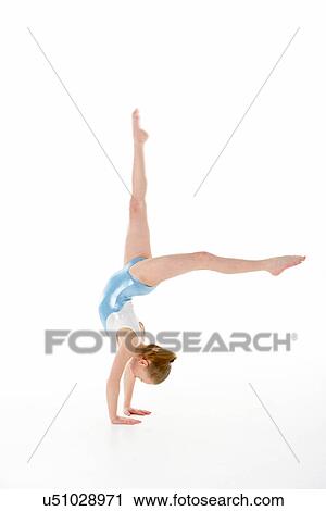 Stock Image - Studio Portrait Of Young Female Gymnast. Fotosearch