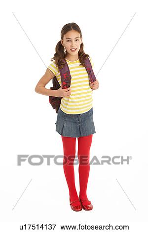 Stock Photo - Studio Portrait Of Young Girl With Backpack. Fotosearch