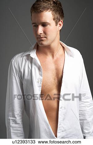 Studio Portrait Of Young Man Wearing Open Shirt View Large Photo Image Stock Image - Studio Portrait Of Young Man Wearing Open Shirt. Fotosearch