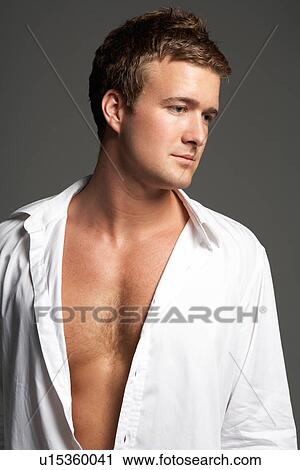 Studio Portrait Of Young Man Wearing Open Shirt View Large Photo Image Stock Image - Studio Portrait Of Young Man Wearing Open Shirt. Fotosearch
