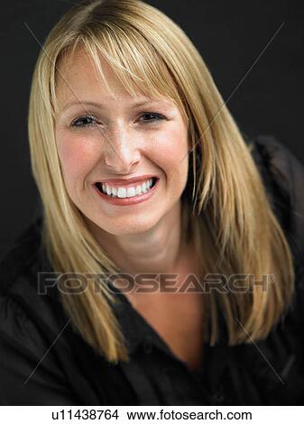 Studio Portrait Of Young Woman Against Black Background View Large Photo Image Picture - Studio Portrait Of Young Woman Against Black Background. Fotosearch