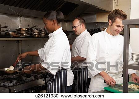 Team Of Chefs Preparing Food In Restaurant Kitchen View Large Photo Image Stock Image - Team Of Chefs Preparing Food In Restaurant Kitchen. Fotosearch