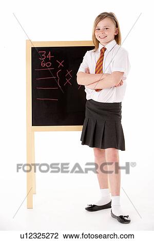 Thoughtful Female Student Wearing Uniform Next To Blackboard View Large Photo Image Stock Image - Thoughtful Female Student Wearing Uniform Next To Blackboard. Fotosearch