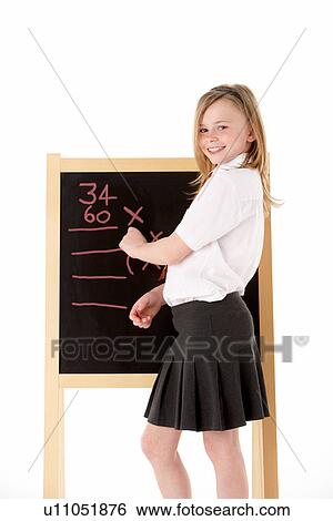 Thoughtful Female Student Wearing Uniform Next To Blackboard View Large Photo Image Stock Photograph - Thoughtful Female Student Wearing Uniform Next To Blackboard. Fotosearch