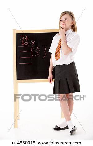 Thoughtful Female Student Wearing Uniform Next To Blackboard View Large Photo Image Stock Photography - Thoughtful Female Student Wearing Uniform Next To Blackboard. Fotosearch
