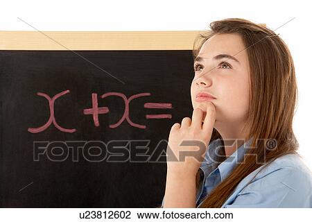 Thoughtful Looking Female Student Standing Next To Blackboard View Large Photo Image Stock Image - Thoughtful Looking Female Student Standing Next To Blackboard. Fotosearch