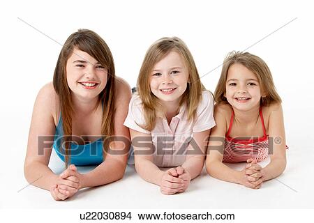 Three Girls Piled Up In Pyramid In Studio View Large Photo Image Picture - Three Girls Piled Up In Pyramid In Studio. Fotosearch
