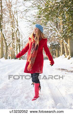 Woman Walking Through Snowy Woodland View Large Photo Image Stock Image - Woman Walking Through Snowy Woodland. Fotosearch