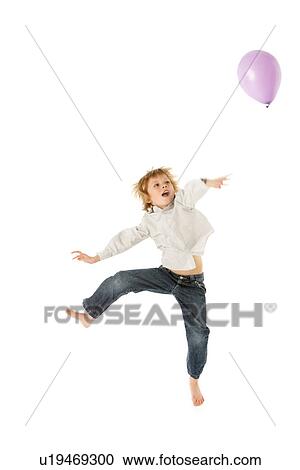Young Boy Jumping With Balloon In Studio View Large Photo Image Stock Image - Young Boy Jumping With Balloon In Studio. Fotosearch