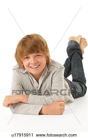 Young Boy Lying On Stomach In Studio View Large Photo Image Stock Image - Young Boy Lying On Stomach In Studio. Fotosearch