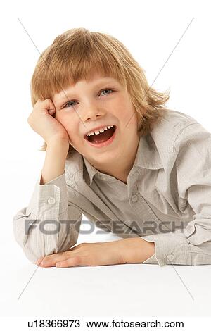 Young Boy Lying On Stomach In Studio View Large Photo Image Stock Image - Young Boy Lying On Stomach In Studio. Fotosearch
