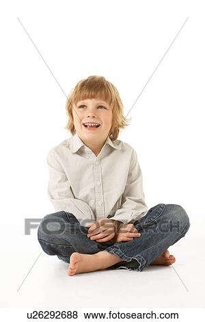 Young Boy Sitting In Studio View Large Photo Image Stock Photo - Young Boy Sitting In Studio. Fotosearch