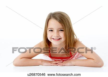 Young Girl Lying On Stomach In Studio View Large Photo Image Stock Photograph - Young Girl Lying On Stomach In Studio. Fotosearch