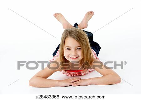 Young Girl Lying On Stomach In Studio View Large Photo Image Stock Photograph - Young Girl Lying On Stomach In Studio. Fotosearch