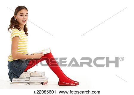 Young Girl Sitting On Pile Of Books Reading View Large Photo Image Stock Image - Young Girl Sitting On Pile Of Books Reading. Fotosearch