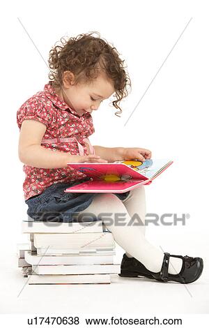 Young Girl Sitting On Pile Of Books Reading View Large Photo Image Stock Photo - Young Girl Sitting On Pile Of Books Reading. Fotosearch