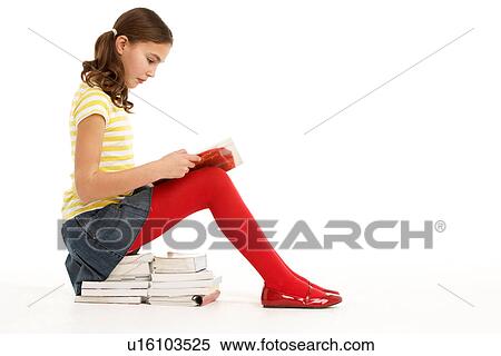 Young Girl Sitting On Pile Of Books Reading View Large Photo Image Stock Photography - Young Girl Sitting On Pile Of Books Reading. Fotosearch