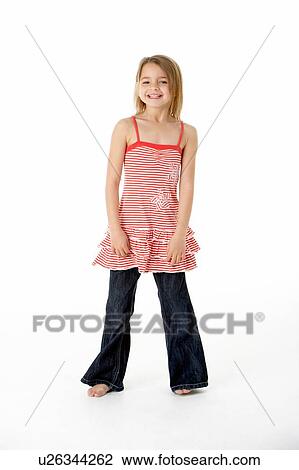 Stock Image - Young Girl Standing In Studio. Fotosearch