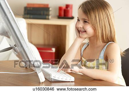 Young Girl Using Computer At Home View Large Photo Image Stock Photograph - Young Girl Using Computer At Home. Fotosearch