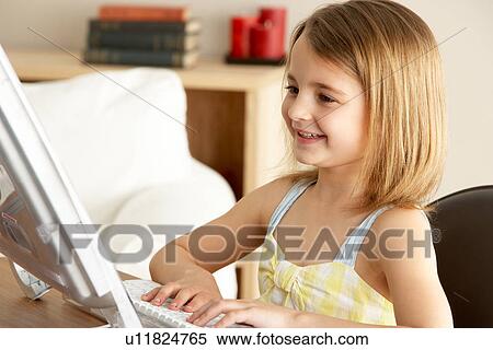 Young Girl Using Computer At Home View Large Photo Image Stock Photography - Young Girl Using Computer At Home. Fotosearch