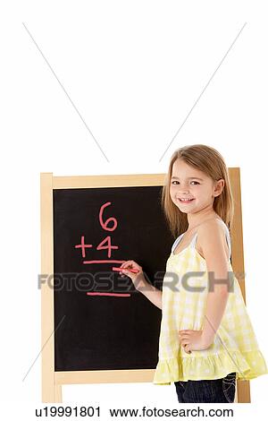 Stock Image - Young Girl Writing On Blackboard. Fotosearch