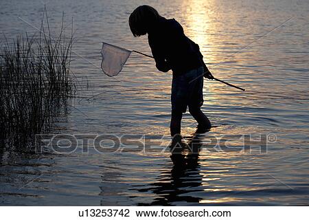 12-year old girl with fishing net looking for minnows in Miller Lake at sunset; Bruce Peninsula View Large Photo Image Stock Image - 12-year old girl with fishing net looking for minnows in Miller Lake at sunset; Bruce Peninsula. Fotosearch