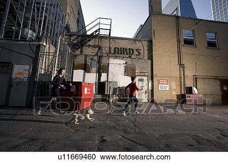 2 women and dog running at rear of downtown buildings, Regina, Saskatchewan View Large Photo Image Stock Image - 2 women and dog running at rear of downtown buildings, Regina, Saskatchewan. Fotosearch
