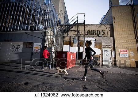 2 women and dog running at rear of downtown buildings, Regina, Saskatchewan View Large Photo Image Stock Image - 2 women and dog running at rear of downtown buildings, Regina, Saskatchewan. Fotosearch