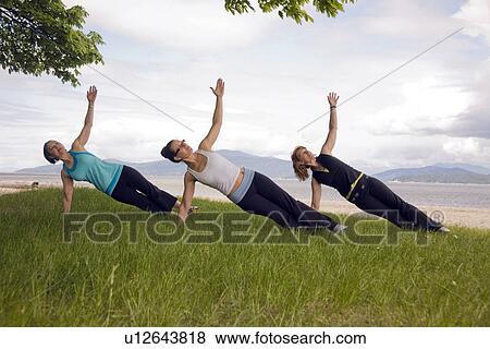3 women in yoga pose, Vancouver, BC View Large Photo Image Stock Photo - 3 women in yoga pose, Vancouver, BC. Fotosearch