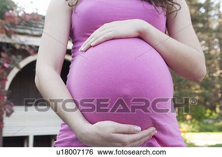 Abdomen of pregnant woman, Manitoba, Canada View Large Photo Image Stock Photograph - Abdomen of pregnant woman, Manitoba, Canada. Fotosearch