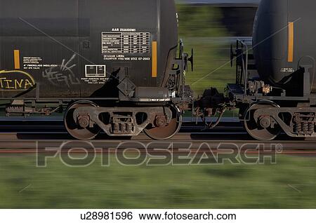 Blurred pan photo of tank cars on a freight train View Large Photo Image Stock Photograph - Blurred pan photo of tank cars on a freight train. Fotosearch