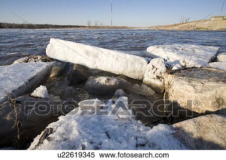 Stock Photography - Chunks of spring ice on the Red River, rural Manitoba. Fotosearch