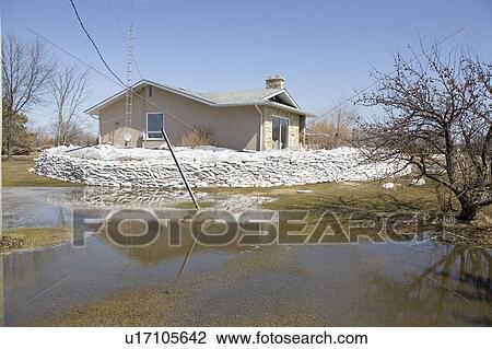 Dyke of sandbags around rural home to protect from Red River floodwaters, rural Manitoba View Large Photo Image Stock Image - Dyke of sandbags around rural home to protect from Red River floodwaters, rural Manitoba. Fotosearch