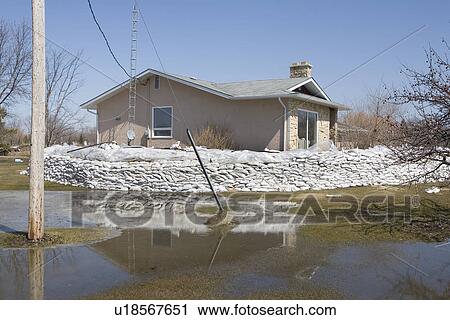 Dyke of sandbags around rural home to protect from Red River floodwaters, rural Manitoba View Large Photo Image Stock Image - Dyke of sandbags around rural home to protect from Red River floodwaters, rural Manitoba. Fotosearch