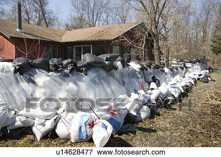 Dyke of sandbags around rural home to protect from Red River floodwaters, rural Manitoba View Large Photo Image Stock Photo - Dyke of sandbags around rural home to protect from Red River floodwaters, rural Manitoba. Fotosearch