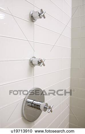 Stock Image - Faucets, low-flow, shower stall. Fotosearch