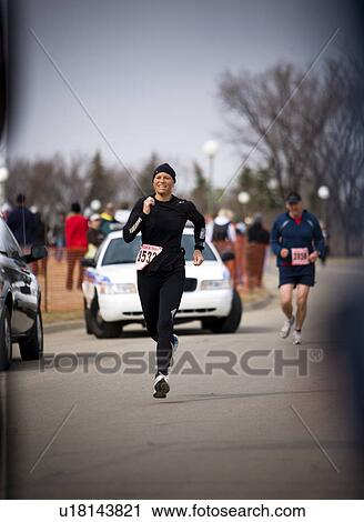 Female runner still strong in marathon, Regina, Saskatchewan View Large Photo Image Stock Image - Female runner still strong in marathon, Regina, Saskatchewan. Fotosearch