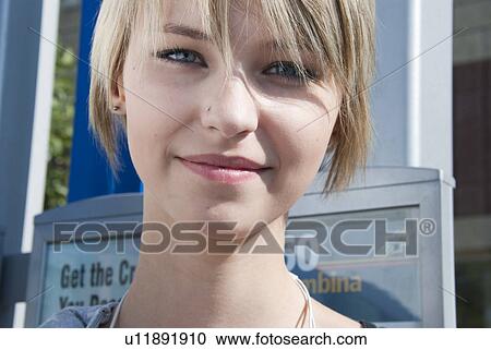 Stock Image - Female teen on street, Winnipeg, Manitoba, Canada. Fotosearch