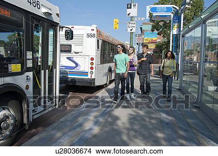 Group of teens walking twoard bus, Winnipeg, Manitoba, Canada View Large Photo Image Picture - Group of teens walking twoard bus, Winnipeg, Manitoba, Canada. Fotosearch