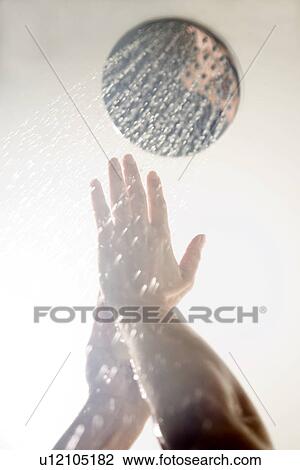Hands under low-flow shower head View Large Photo Image Stock Image - Hands under low-flow shower head. Fotosearch