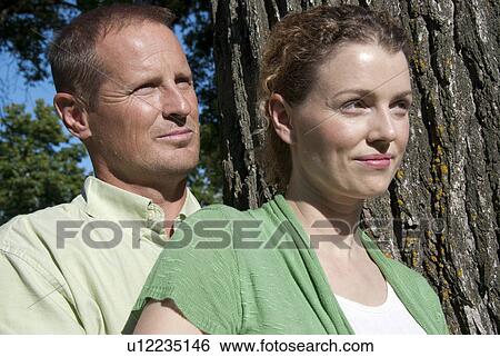 Head and shoulders shot of couple beside tree, Assiniboine Park, Winnipeg, Canada View Large Photo Image Stock Photograph - Head and shoulders shot of couple beside tree, Assiniboine Park, Winnipeg, Canada. Fotosearch