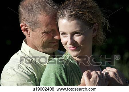 Stock Photo - Head shot couple in their 40's, Winnipeg, Canada. Fotosearch