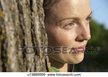 Head shot of woman in her 40s beside tree, Assiniboine Park, Winnipeg, Canada View Large Photo Image Stock Photo - Head shot of woman in her 40s beside tree, Assiniboine Park, Winnipeg, Canada. Fotosearch