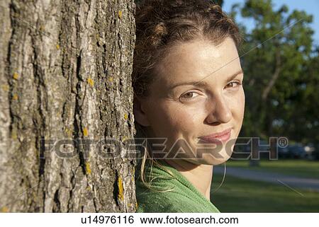 Head shot of woman in her 40s beside tree, Assiniboine Park, Winnipeg, Canada View Large Photo Image Stock Photograph - Head shot of woman in her 40s beside tree, Assiniboine Park, Winnipeg, Canada. Fotosearch