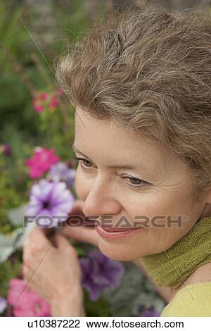 High angle close up woman in garden, Manitoba, Canada View Large Photo Image Stock Image - High angle close up woman in garden, Manitoba, Canada. Fotosearch