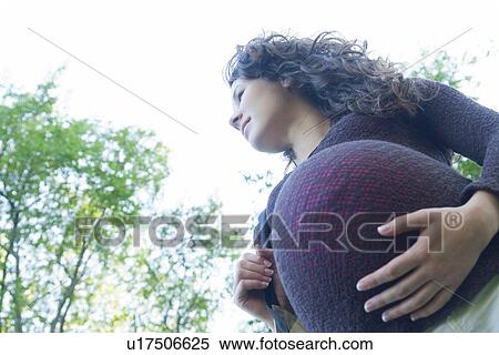 Low angle of very pregnant woman, Manitoba, Canada View Large Photo Image Stock Photography - Low angle of very pregnant woman, Manitoba, Canada. Fotosearch
